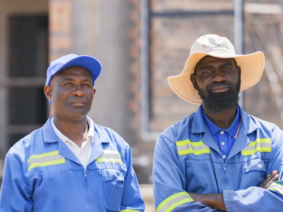 Two workers in matching branded workwear